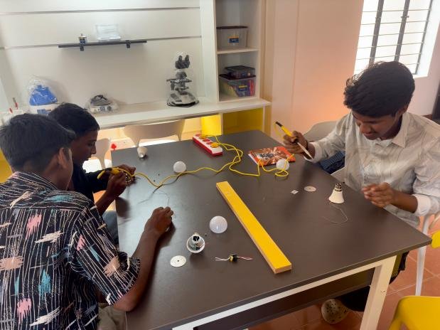 Student assembling an LED bulb